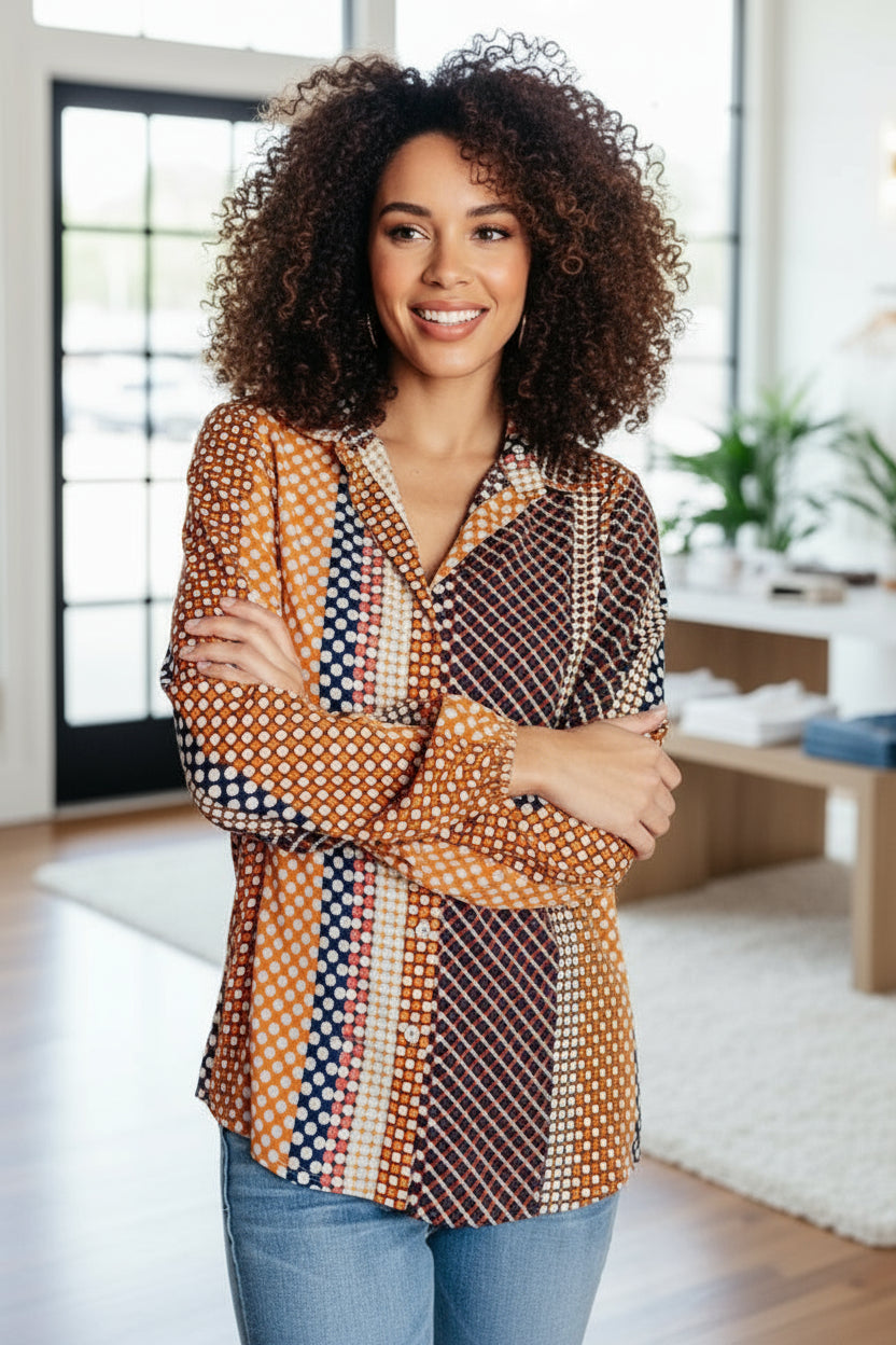 Woman wearing a patterned shirt in a home setting
